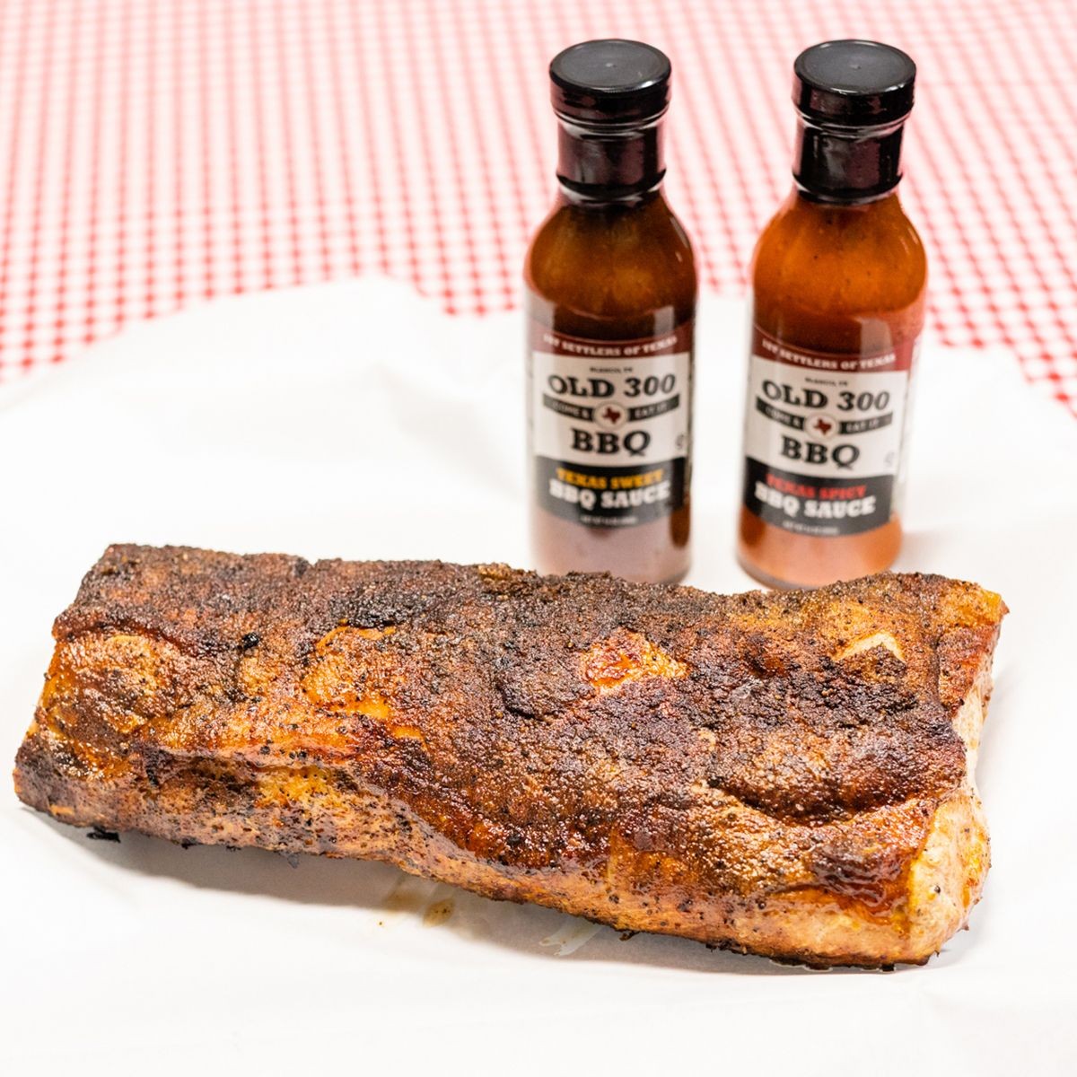 Smoked pork loin and sweet and spicy sauces from Old 300 BBQ