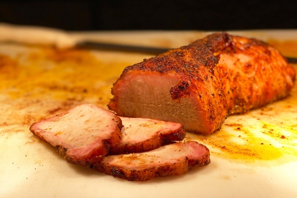 Slices of pork loin being cut at Old 300 BBQ